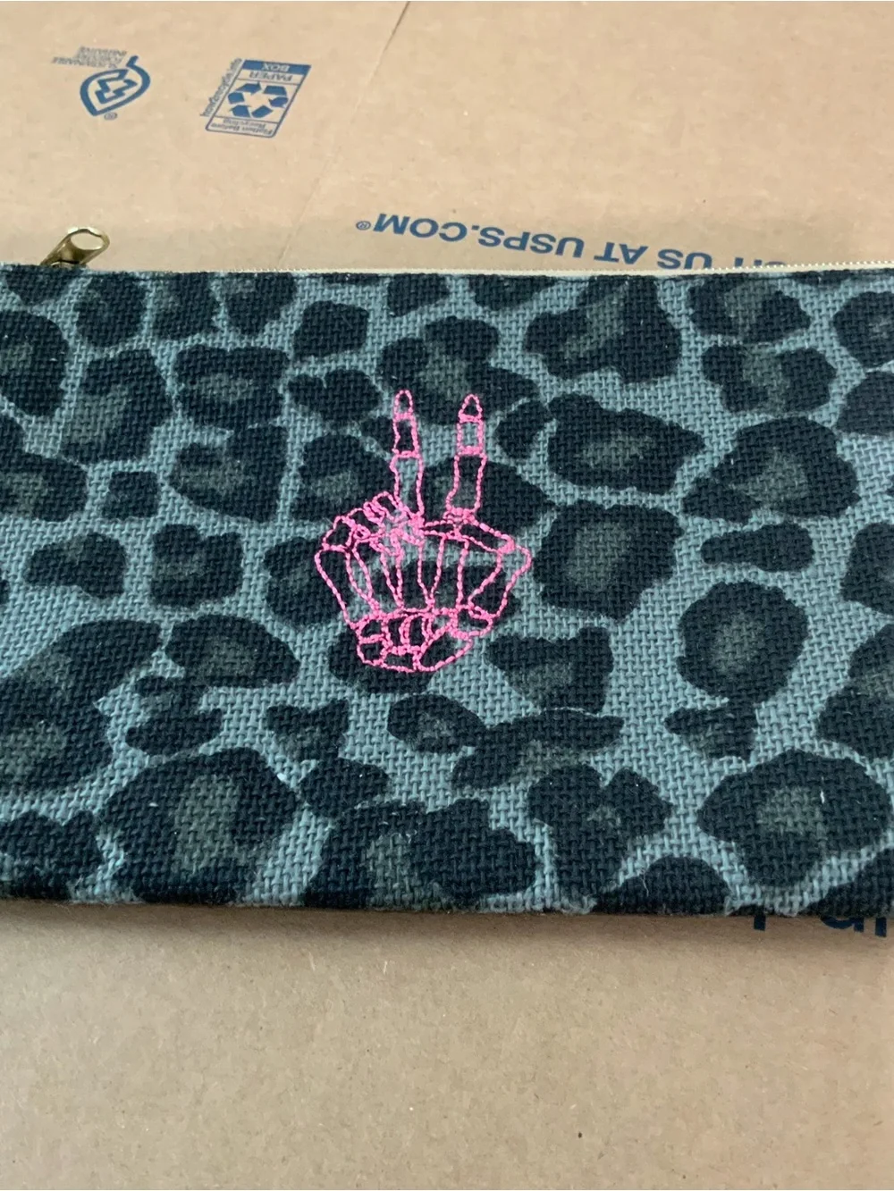Leopard Print Zip Pouch with Pink Skeleton Hand Detail